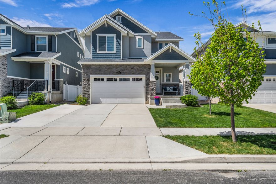 Highly sought-after Holbrook Farms home featuring a stunning kitchen with beautiful countertops and refined finishes, opening to a spacious family room. The thoughtfully designed layout offers bright, flowing living spaces-perfect for everyday living and entertaining.