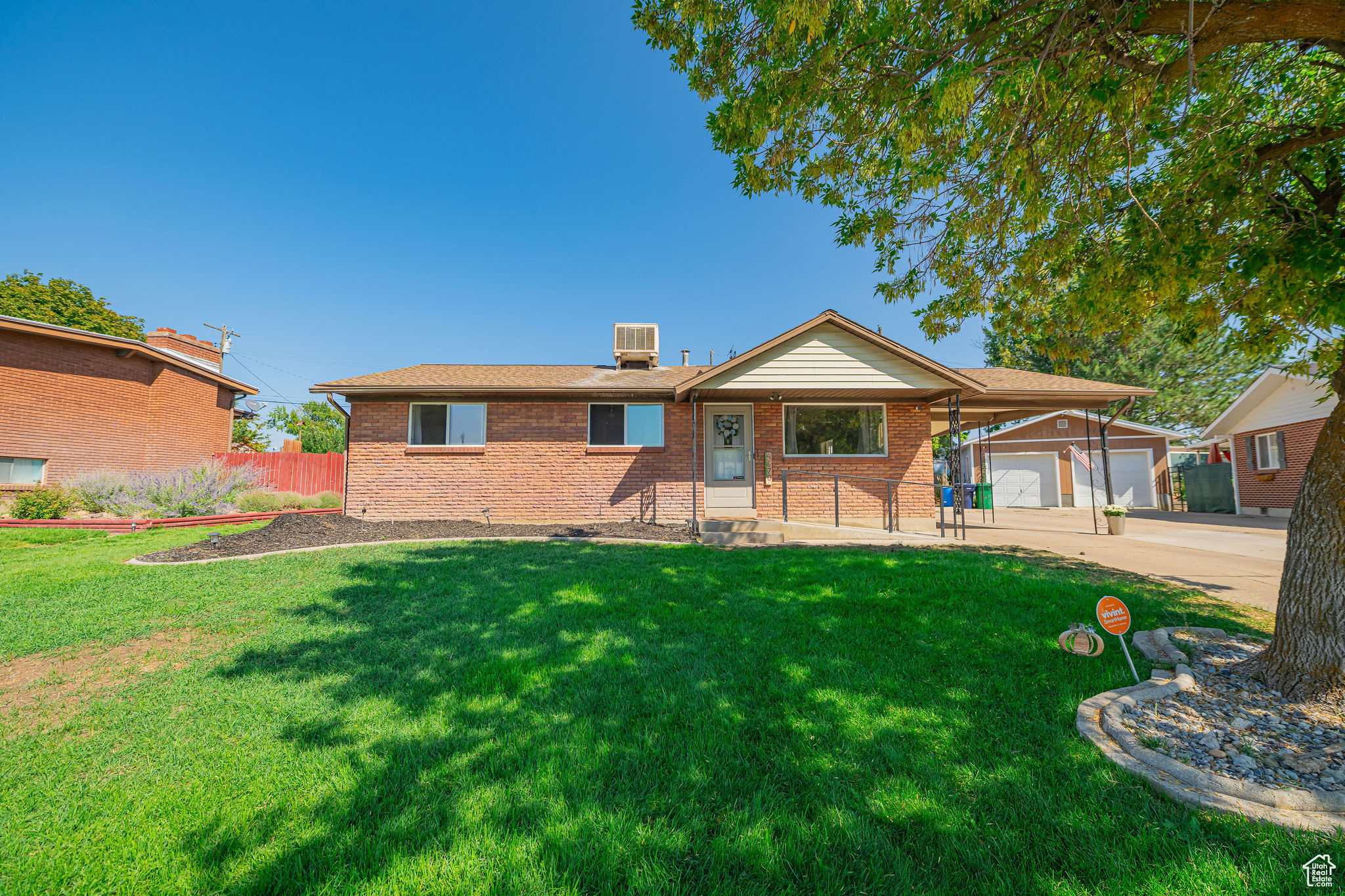 Discover this Roy gem offering comfortable main-level living in a quiet, established neighborhood. This well-kept single-level home features a remodeled kitchen with new cabinets, countertops, sink, disposal, appliances, and fresh wallpaper accents. The bathroom has been upgraded with a new vanity, mirror, toilet, tile flooring, tub/shower walls, trim, and light fixtures. Flooring updates include new carpet in the back bedrooms and added hardwood in the front bedroom and laundry room. A front bedroom addition (approx. 2 years ago) provides flexible space for guests, an office, or hobbies. Additional perks include a security system, carport, storage unit, and potential for extra parking on the north side. Outside, enjoy a versatile backyard perfect for gatherings. With 3 bedrooms, 1 bath, and a welcoming layout, this home blends updates, charm, and convenience-close to schools, parks, shopping, and more!