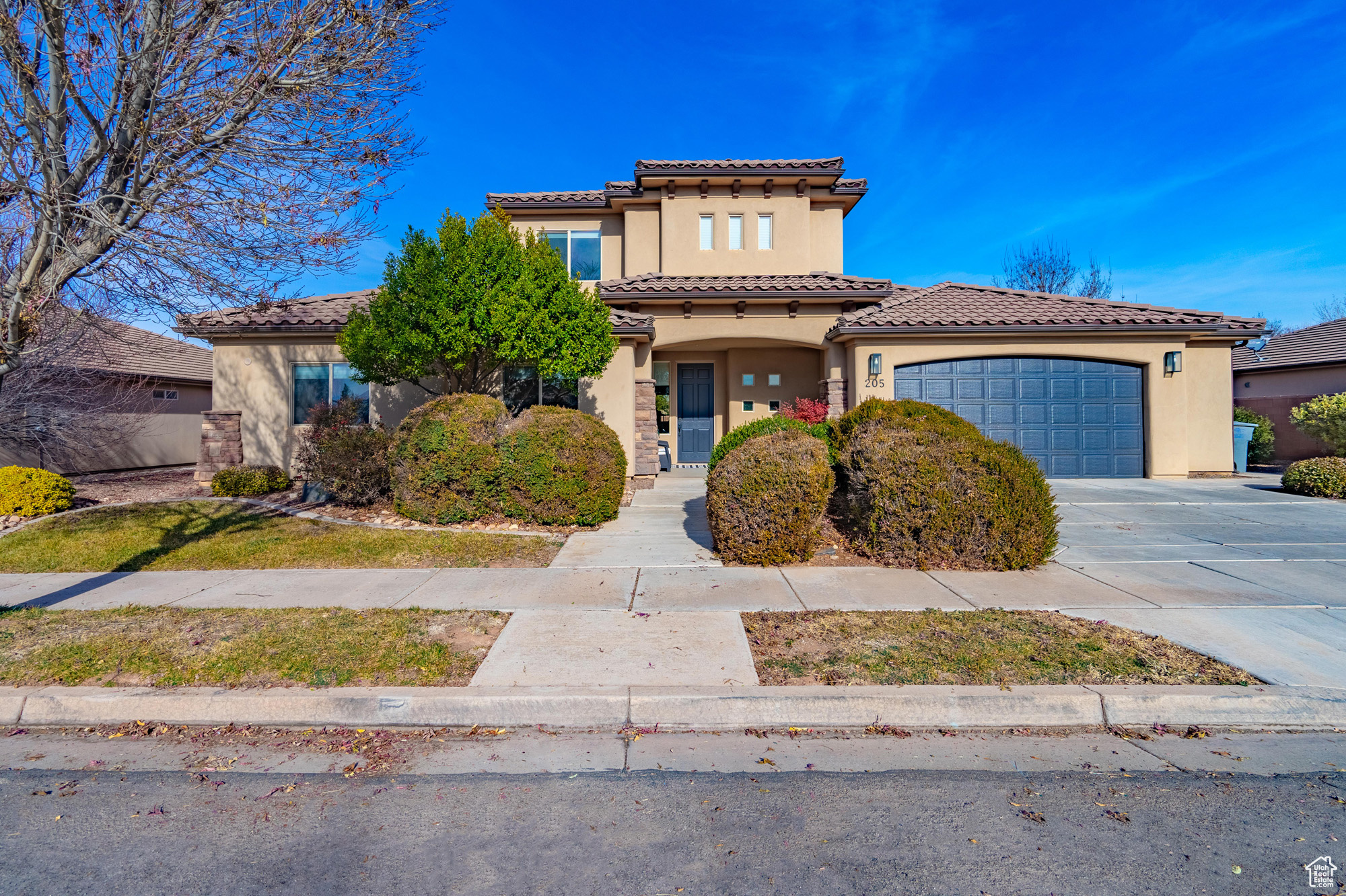 Stunningly remodeled home in the highly desirable Treasure Valley neighborhood! Step inside to find brand-new flooring throughout, gleaming stainless steel appliances, a gourmet gas range, and designer touches like painted cabinets, a chic backsplash, updated lighting, modern hardware, and luxurious quartz countertops.   The oversized garage with RV parking is perfect for adventure-ready gear, while tons of storage keep everything organized. Upstairs, a spacious family room opens to breathtaking, unobstructed views of the mountains and cityscape. Two additional bedrooms and a full bath make this upper level a perfect retreat.  Enjoy low HOA dues for easy yard maintenance and Dixie Power benefits. Ideally located close to schools, shopping, and endless outdoor activities around St. George, this home has it all!