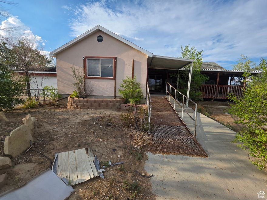 Fixer-Upper with major potential on 3.9 Acres This 4 bed, 2 bath home spans 3,284 sq ft with an additional 1,000 sq ft 2-car garage and 600 sq ft covered deck. A spacious layout, formal dining, large living room, and covered porch, this home offers serious upside for investors or contractors. Two additional parcels available separately: 02-2271-006B (1.04 acres) 02-2271-006A (1.07 acres)  Sold as-is.  A rare opportunity to bring this property back to life. Square footage figures are provided as a courtesy estimate only.  Buyer is advised to obtain an independent measurement.
