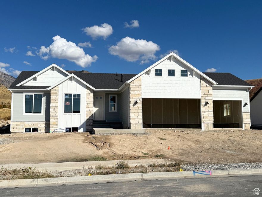 BRAND NEW RAMBLER on the Smithfield Bench! Welcome to the "EMERSON 1656" floor plan. This amazing home has 3 bedrooms, 2.5 bathrooms, 3 car garage and 9 feet ceilings on the finished main level. Open concept Kitchen / dining /living room with a kitchen island, custom made cabinets, quartz counter tops and spacious pantry. Also many tall windows to create a bright and welcoming space. Take a step into the main floor principal bedroom and you will fall in love with the elegant tray ceilings, spa-like master bathroom with granite counter tops and separate tub and shower. You will be amazed at the size of the walk in closet! The unfinished basement offers endless possibilities with space for an additional 3 bedrooms, a full bath, and a spacious family room, providing flexibility for future growth. Mountain and Valley views are visible from every window. The builder's attention to detail and functionality shines in every corner of this home. Come see for yourself what makes this property truly special! Estimated Completion by End of October. Call agent for more details.