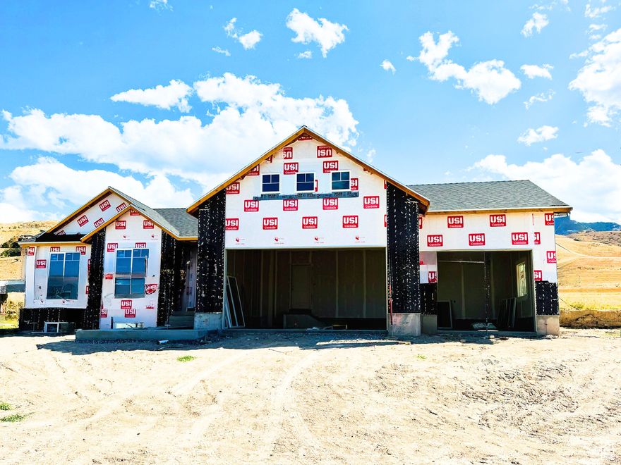 BRAND NEW RAMBLER on the Smithfield Bench! Welcome to the "EMERSON 1656" floor plan. This amazing home has 3 bedrooms, 2.5 bathrooms, 3 car garage and 9 feet ceilings on the finished main level. Open concept Kitchen / dining /living room with a kitchen island, custom made cabinets, quartz counter tops and spacious pantry. Also many tall windows to create a bright and welcoming space. Take a step into the main floor principal bedroom and you will fall in love with the elegant tray ceilings, spa-like master bathroom with granite counter tops and separate tub and shower. You will be amazed at the size of the walk in closet! The unfinished basement offers endless possibilities with space for an additional 3 bedrooms, a full bath, and a spacious family room, providing flexibility for future growth. Mountain and Valley views are visible from every window. The builder's attention to detail and functionality shines in every corner of this home. Come see for yourself what makes this property truly special! Estimated Completion by End of October. Call agent for more details.
