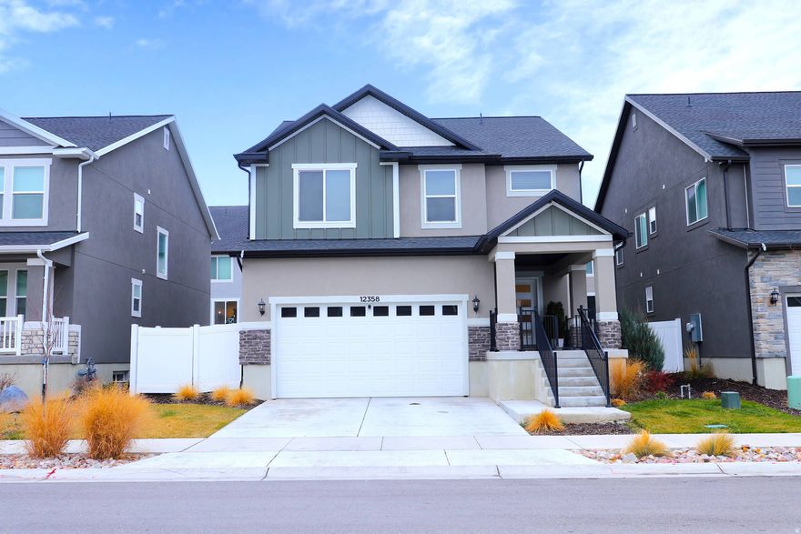 Don't miss this extraordinary home in Herriman! The fully finished basement offers additional living space with a living room, an extra bedroom, a bathroom with a shower, laundry facilities, and a full kitchen; ideal for guests or extended family, with the potential to add a separate entrance in the future, as there is ample space for it. The main floor features a spacious open-concept living area, laminate wood flooring, large windows, and high ceilings, creating a bright and airy atmosphere. The open kitchen is equipped with modern appliances, ample counter space, and a center island with seating. The dining area is spacious and can accommodate a large table, perfect for entertaining. Upstairs, the primary suite is a luxurious retreat with a large walk-in closet and a well-appointed en-suite bathroom. The two other bedrooms on the upper level are generously sized and also receive plenty of natural light. The large laundry room is conveniently located upstairs, making laundry day a breeze. Large windows throughout the home provide abundant natural light. It features a two-car garage, with space for two more vehicles in the driveway, and available space in the front yard that could be expanded to provide additional parking. You'll also enjoy a large, inviting covered front porch and a spacious backyard, fully fenced and landscaped. The refrigerators, washers, and dryers (both in the main house and the basement) are included, all recent models and in excellent condition. Square footage figures are provided as an estimate only and are based on county records. Buyer is advised to obtain an independent measurement.