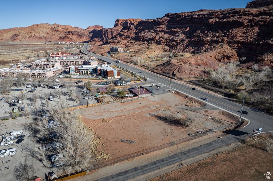 A prime development parcel located in Moab's northern corridor, near Arches National Park and Scenic Highway 128, offering exceptional visibility to travelers from around the world. Zoned as Resort Commercial, this district is designed to create a welcoming gateway to the City of Moab and Grand County, promoting a dynamic mix of residential and commercial development. The zoning allows for both resort guest-oriented and locally focused commercial uses within an urban setting. This lot also features breathtaking views of the Colorado River Portal, as well as convenient access to bike trails and downtown Moab.