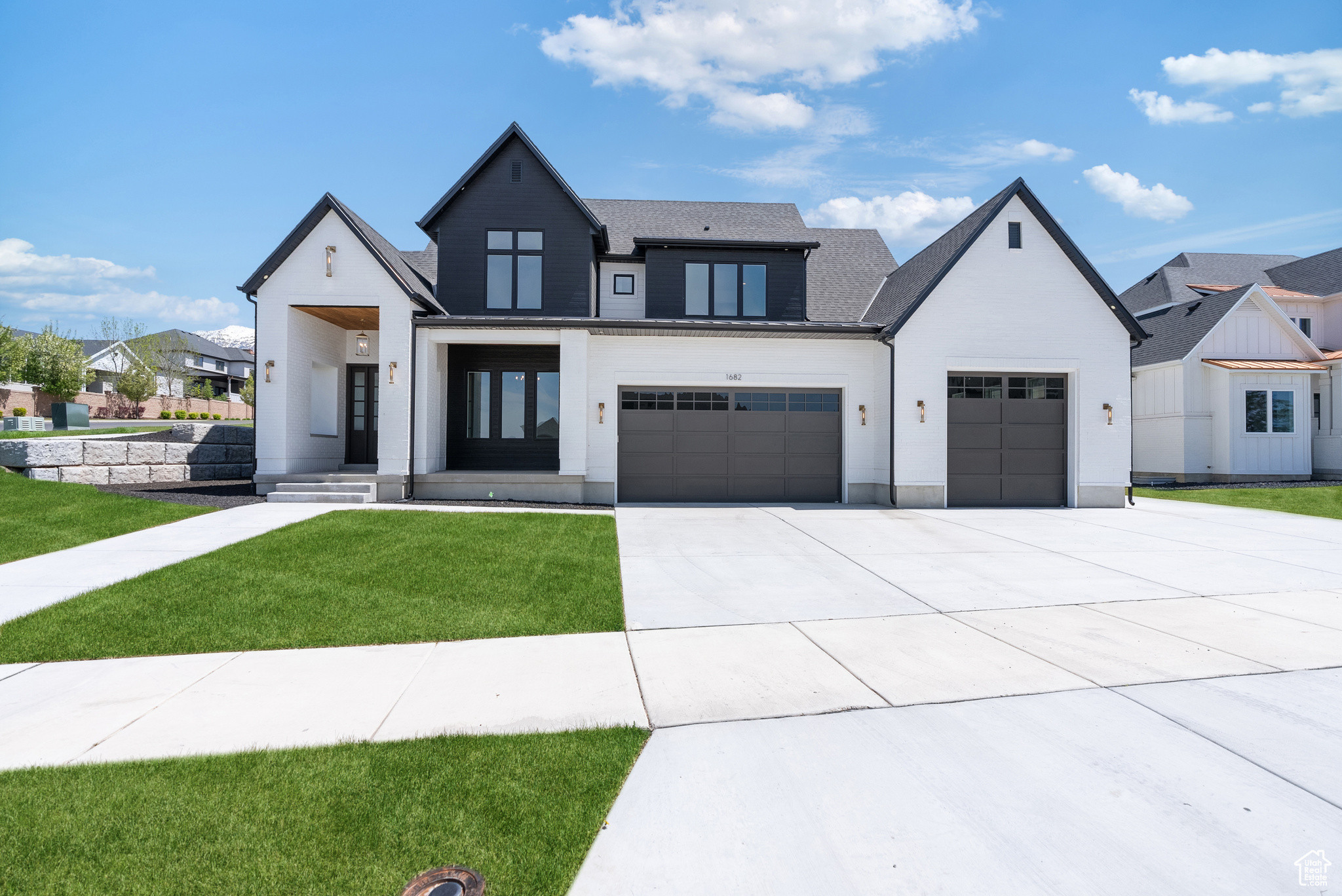This beautiful custom home in Provo, Utah is situated on a corner lot, providing ample space and privacy. The sliding doors on the exterior are prepared for future connections to a pool or outdoor kitchen, with power and water readily available. The large driveway and spacious three-car garage offer plenty of room for parking, even accommodating a boat or a small RV. This custom home is equipped with the state-of-the-art Control4 smart home system. This advanced technology allows homeowners to effortlessly control various aspects of their home, enhancing convenience and comfort. With the Control4 system, you can easily manage the lighting, temperature, security, and entertainment systems throughout the house. One standout feature of this smart home is the theatre room and home gym located in the basement.