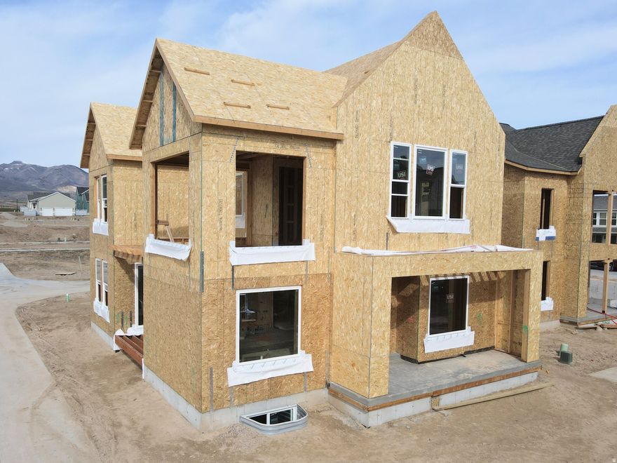 Currently under construction, this highly sought-after "Adventurer" floor plan showcases the beautiful cedar wood exterior and includes a FINISHED basement. Great livability from multiple outdoor living spaces designed to extend your living area beyond the walls of the home. The price includes impressive designer upgrades such as 9-foot ceilings on all levels, a cozy fireplace, modern railing, and a coveted indoor/outdoor layout with oversized sliding glass doors connecting the Great Room and Kitchen to the patio, perfect for entertaining. A bright main-level office is filled with natural light from abundant windows, creating an ideal space for work or relaxation. Upstairs, the dreamy Primary Suite features a private, covered balcony that is hot tubready, along with a luxurious en-suite bathroom complete with a standalone soaking tub and a spacious walk-in shower. *Interior finished photos are of a previously built home of the same floor plan for example purposes. Upgrades and finishes will vary* Estimated completion: Late Summer-Early Fall 2026.