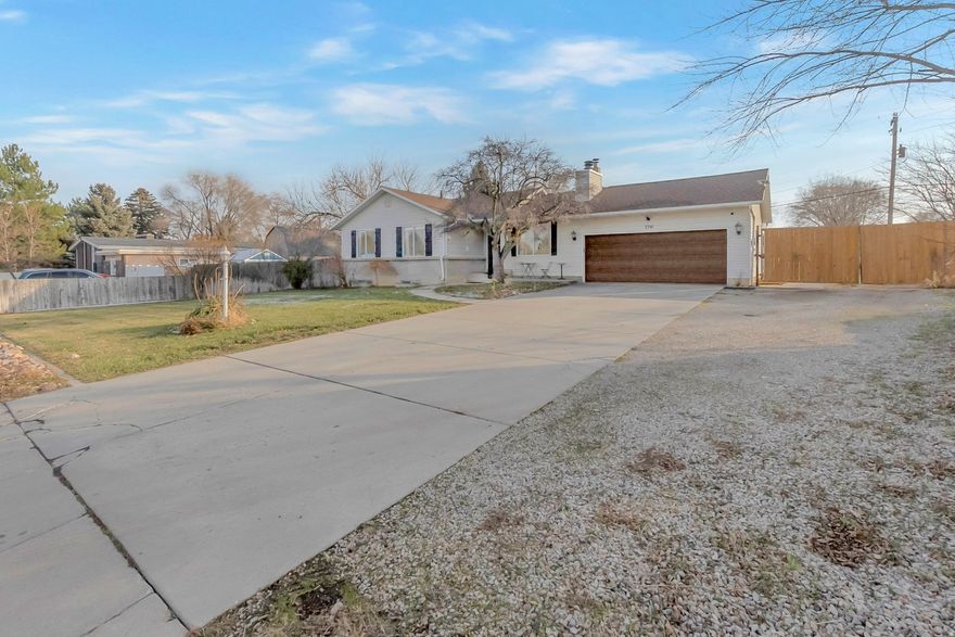 Rare opportunity to own nearly an acre in West Jordan while remaining close to shopping, schools, and freeway access. Enjoy elbow room for horses, equipment, RVs, or a home-based business without relocating to the middle of nowhere. The property includes horse stalls, a chicken coop, and ample enclosed storage ideal for hay, equipment, and outdoor toys. The home features a second kitchen and laundry ideal for a mother-in-law apartment or great entertainment space, offering flexible living or income potential. Additional features include irrigation water access at the rear of the property, a centrally located tack shed, and a large dog run and separate garden area with raised garden boxes near the home. A hard-to-find combination of usable land, versatility, and Salt Lake Valley convenience.