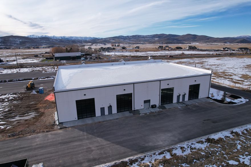 Discover an exceptional opportunity to secure a .76-acre pad-ready commercial building lot within the highly desirable Route 32 Project-one of the fastest-growing commercial corridors in the Kamas Valley. This site is fully improved and ready for immediate development, offering unmatched convenience, visibility, and long-term value for any owner-user, investor, or business looking to establish a presence in a thriving market. This premium lot comes fully prepared with all utilities already stubbed, including power, water, sewer, and fiber, significantly reducing both cost and timeline to build. With level topography, engineered soils, and direct access from Route 32, the site is perfectly suited for office, flex, retail, light commercial, or mixed-use applications. Positioned within a master-planned flex campus featuring high-quality construction, modern architecture, and professional neighboring businesses, this parcel benefits from excellent traffic counts, strong local demographics, and year-round activity from recreation, tourism, and full-time residents. Whether you're expanding your commercial footprint or looking for a strategic long-term asset, this lot offers the rare combination of readiness, location, and future upside-all within one of Utah's most supply-constrained markets.  .76 acres , pad-ready and fully buildable Engineered pad with level, compacted soils. Fast-growing area with strong demand and limited commercial inventory. Excellent visibility and accessible directly from Route 32 All utilities onsite and stubbed (power, water, sewer, fiber) Ideal for flex, office, retail, or light commercial Part of the upscale Route 32 flex campus