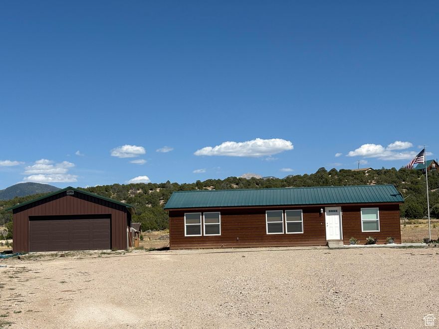 Discover your dream sanctuary in this nearly new manufactured home set on a picturesque 5-acre lot. Enjoy the tranquility of quiet country living while being surrounded by breathtaking vistas and abundant wildlife - perfect for nature lovers!  This property offers animal rights, making it ideal for those looking to embrace a rural lifestyle. The spacious garage features new insulation and electrical upgrades, providing both comfort and convenience.  Step outside onto the generous patio, perfect for entertaining or unwinding while soaking in the serene landscape. Don't miss your chance to own this exquisite piece of land that combines modern living with the beauty of nature.