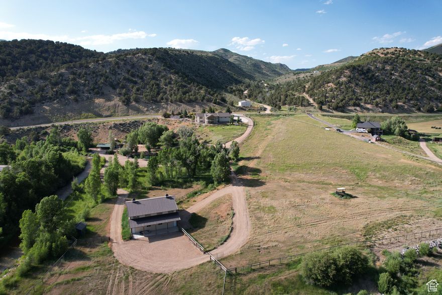 Offered with all furniture included. Located just 9 miles from Coalville and I-80! Less than an hour to Salt Lake City or Ogden. Includes 1/2 mile of Chalk Creek frontage. Fenced for horses, horse barn.