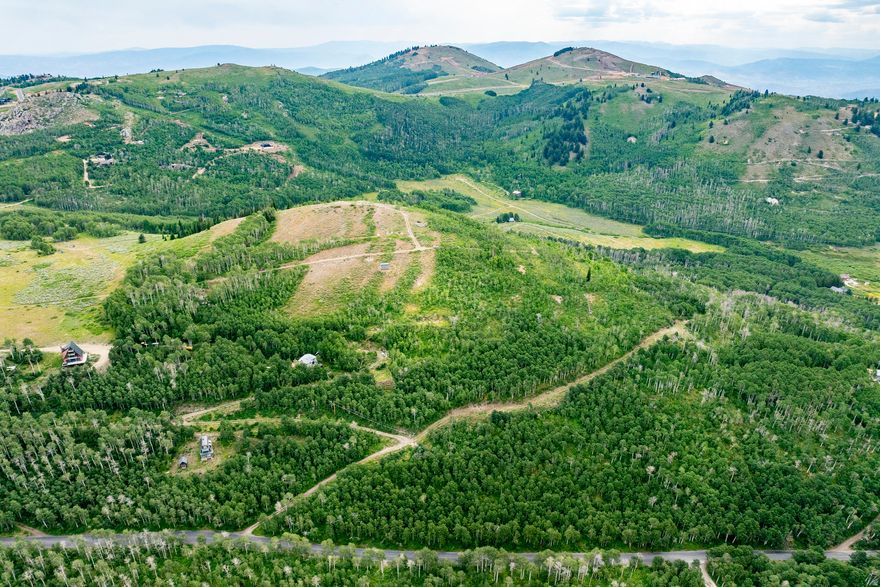 Enjoy the privacy and grandeur of 24+ acres of the top and south-facing aspects of Lone Hill, towering above Bonanza Flats and 23,000 acre Wasatch Mountain State Park. This heavily wooded parcel has remarkable potential given its five entitlements. Motorsports abound. World class mountain biking and skiing are very close by, as are The Montage, Deer Valley Resort (tm) and Park City's Historic Main Street. Electricity and high-speed internet are available.