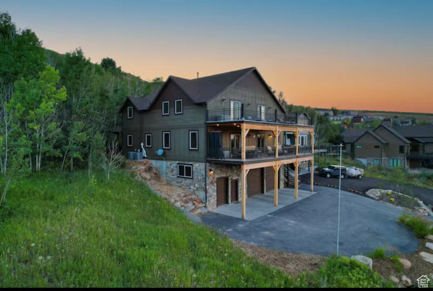 "Spectacular Views of Bear Lake!* 2 huge decks facing the lake. Covered patio with a hot tub surrounded by a grove of aspen  trees in the back. Year round access with paved road. 3 En-suite bedrooms plus 3 additional bedrooms, top of the line  appliances, and many more. Home is being sold furnished with a few exclusions. This is a great family home or investment  property for nightly rentals. Sleeps up to 22 comfortably and plenty of room for more if needed.