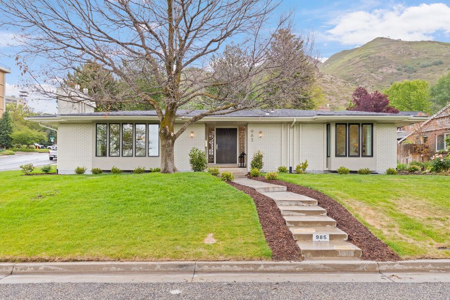 Welcome to this stunning fully remodeled home, perfectly positioned on a premium corner lot with breathtaking views of downtown. Step inside to discover a beautifully reimagined interior featuring vaulted ceilings, numerous gathering spaces, high end designer touches, custom lighting, and faucets, and more. The chef-inspired kitchen includes a butler's pantry, massive counter spaces, a huge island, beautiful stone counter tops and backsplash, premium appliances, custom cabinets, and an elegant range hood.  Don't miss the pebble ICE MACHINE to the left of the sink! Multiple living and entertaining areas provide the perfect setting for hosting guests or enjoying everyday gatherings. The modernized layout includes a gorgeous primary en-suite that is a true spa-like experience.  Every detail of this home has been thoughtfully curated to create a modern, sophisticated retreat in an unbeatable location.  This is a rare opportunity to own a luxury home with incredible entertaining space, and unforgettable downtown views in this exclusive neighborhood.  Square footage figures are provided as a courtesy estimate only and were obtained from appraisal.  Buyer is advised to obtain an independent measurement.