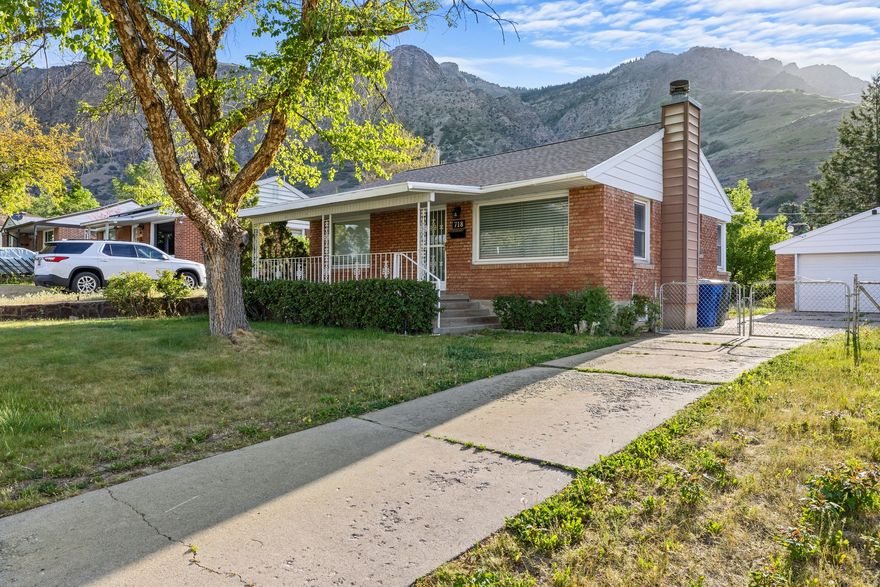 Charming brick East Side bungalow with modern updates throughout! Features a new roof, hardwood floors, and a spacious, oversized garage. Enjoy the private, flat backyard with amazing mountain views - perfect for relaxing or entertaining. The basement includes egress windows in the bedrooms for added light and safety. A great blend of classic character and modern convenience! New water softener and updated mechanical.