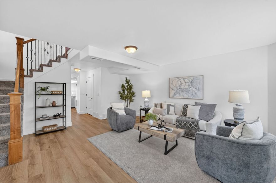 Beautiful end-unit townhome in one of Lehi's most convenient and fast-growing neighborhoods! Fully refreshed and move-in ready with designer-inspired updates throughout. From the moment you walk in, you'll notice the natural light pouring through the open-concept layout, highlighting the brand-new luxury vinyl plank flooring, fresh modern paint, updated lighting, and thoughtfully upgraded finishes that make this home feel fresh, clean, and elevated.  The kitchen has been thoughtfully updated with granite countertops, new appliances including a refrigerator and oven, and seamless flow into the spacious dining and living areas, creating the perfect setup for everyday living, entertaining, or cozy nights at home. Every detail has been carefully improved, including updated bathroom vanities with soft-close cabinetry, new faucets, upgraded blinds, and a new air conditioner installed in 2025 for added comfort and peace of mind.  As an end unit, this home offers extra privacy, additional windows, and a more open feel than many neighboring units. The oversized 2-car garage and generous storage throughout provide the functionality buyers are looking for without sacrificing style. Outside, enjoy low-maintenance living in a community with a park and playground, walking trail, all while being minutes from shopping, restaurants, Silicon Slopes, I-15 access, Thanksgiving Point, and everything Lehi has to offer.  If you've been waiting for a townhome that feels updated, bright, and truly move-in ready, whether to live in or grow your investment portfolio,  this is the one buyers need to see in person. Homes with this level of updates, natural light, and location golden!