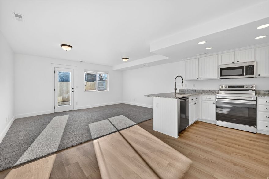 Beautiful townhome in the downtown Lehi area, BRAND NEW updates throughout, including: New LVP wood flooring, granite countertops in kitchen, bathrooms and laundry room, fresh paint throughout entire home, updated lighting and new faucets. New refrigerator, oven, garage door motor, air conditioner (2025), window blinds, and bathroom vanity in the upstairs hall bath & primary bathroom with soft close doors.  The open concept layout is filled with natural light, creating a bright and inviting atmosphere. The main floor living areas are spacious and roomy.  Lots of storage in the garage and inside. Enjoy the added privacy of an end unit, a spacious 2-car garage, and low-maintenance living with community amenities including a park and playground. Close to everything -  shopping, dining, and commuter routes, this is one you don't want to miss!