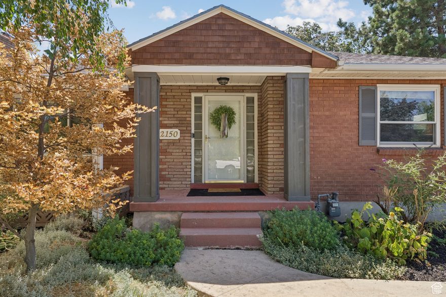 Wonderful brick rambler with a two-bedroom apartment in a desirable East Millcreek location on a large .32 acre lot. Home boasts five bedrooms and three baths including a primary suite with its own en suite bath. Lovely kitchen featuring white cabinets, quartz countertops, tile backsplash and stainless-steel appliances. Spacious living room with crown molding, a gas fireplace and adjacent dining area that opens to the backyard. The yard is large and fully fenced with a brick paved patio, vegetable garden with raised garden beds, fruit trees and would be perfect for BBQs or urban farming. Basement apartment has separate front and rear entrances and features a living room with fireplace, two bedrooms and a bath plus its own parking area making it well suited for use as a rental to help pay your mortgage. Updated flooring and new carpet throughout. Two-car garage with attached shop area plus a two-car carport. Conveniently located just minutes to shopping, restaurants, freeways, schools, parks, Millcreek Common and more! Property is zoned "RM"(Residential Mixed) with Millcreek City. Easy to show, call for your appointment today. Buyer to verify all.