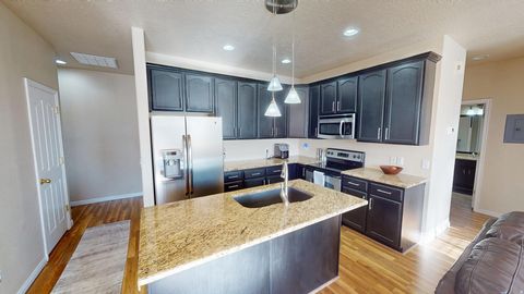 Photo of 6986 W HARLECH LN, West Valley City, UT 84128 (MLS # 2130510)