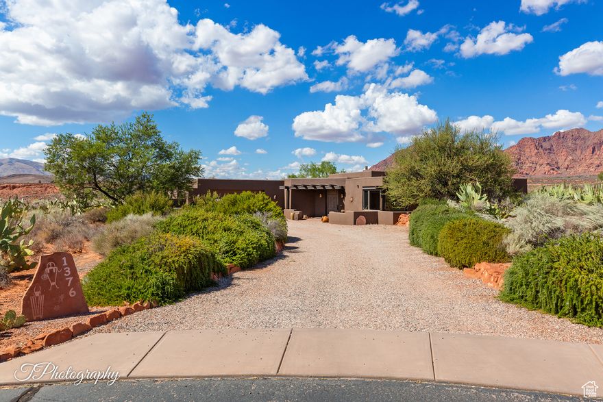 Welcome to 1376 Talachiro. Masterfully sited for inspirational views, seclusion and privacy. A generous .81-acre view lot with lush outdoor living areas and mature landscaping. Well-appointed 3-Bed, 2-Bath home with dedicated Den/Office, and flexible third bedroom used currently as a craft/studio space. A well cared for and deeply loved original owner, this Kayenta custom build offers many extras. Colorful, classic southwestern Pueblo style with abundant natural light and easy access one-level home features a walk-in closet in every bedroom, a huge walk-in pantry, functional large laundry room and a fantastic heated/cooled workshop off the spacious garage. Form and function with a seamless indoor/outdoor footprint, 1376 is a treasured haven for those seeking the road less traveled. 1376 offers an exceptional experience, boasting its proximity to the Kayenta Art Village galleries, the Center For The Arts, Xetava Cafe & Rusted Cactus bar/grill, and unrivaled access to southern Utah's renowned recreational opportunities: Gunlock State Park and reservoir, Dixie National Forest, and Pine Valley alpine recreation area. Embrace the best of life against the stunning backdrop of Kayenta's inspiring red rock cliffs with waterfalls after a desert downpour, overlooking the sprawling 6,000-acre Santa Clara River Reserve. Whether you're stargazing under the night sky or enjoying the "blue view" of Utah's West Mountain, Arizona's Beaver Dam Wash National Conservation Area, the nearby Joshua Tree National Natural Landmark, and countless other wonders await your discovery.