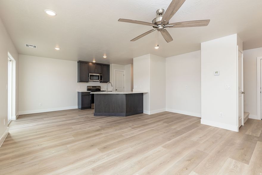 Welcome Home!! Step into modern living with this brand-new 4-bed, 2.5-bath twin home in Gemini Meadows! Clean lines, bright spaces, and a smart 1,822 sq ft layout make this home live large. The open main level is perfect for gathering. Main floor features that sought after 4th bedroom/den. While 3 bedrooms, 2 bathrooms, family space and laundry upstairs keep life convenient. Enjoy a 2-car garage, low-maintenance yard, and a prime Cedar City location. No HOA and quality construction make this a standout. Seller is offering $3,500 toward Buyer's Closing Costs when using preferred lender. Photos of a similar property with same finishes and floor-plan.