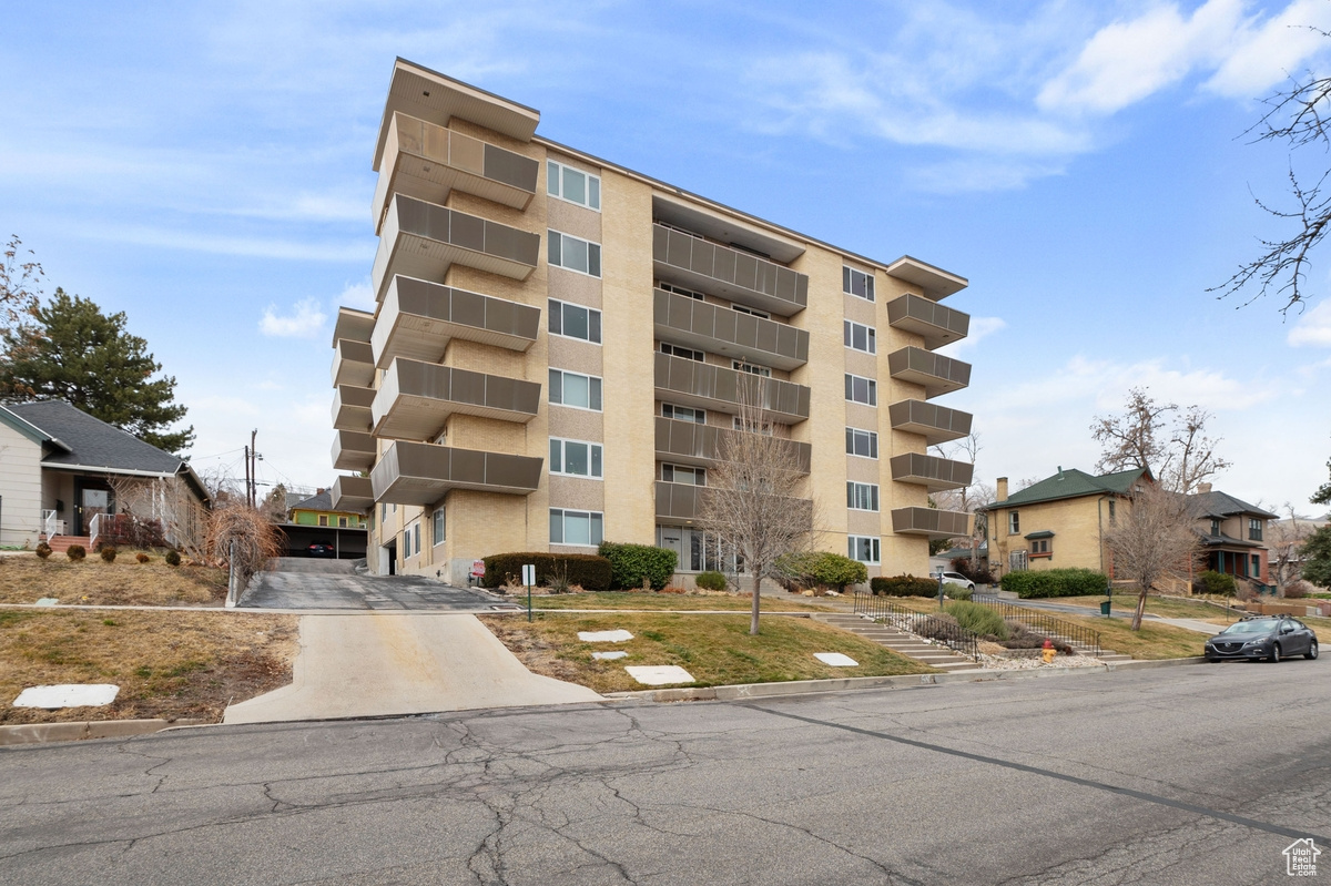 Welcome home to your private oasis in the heart of Downtown SLC. Located in the picturesque neighborhood on the foothills of Salt Lake City, this Avenues Proper condo offers comfort and convenience  in close proximity to everything downtown. Being five minutes away, this property offers the downtown urban lifestyle, while keeping you tucked away on a private and quiet street just above bustle. Also, being in the second most popular neighborhood in Salt Lake City, you will be in an exclusive club. This beautiful corner unit boasts extra square footage with a sprawling open layout, ideal for entertaining family or friends. Warm wood toned flooring and new modern paint grace the spaces, while updated kitchen and bathrooms provide a move in ready condo at an extremely affordable price. The unit also boasts ample natural light, and an in unit washer and dryer, unique to just a couple of condos in the building. Off street covered parking is offered along with a rooftop deck that showcases the amazing views of the downtown skyline. Absolutely ideal for the young professional wanting a little more privacy and an escape from the hustle and bustle, this property is a must see. Call to schedule a showing today!