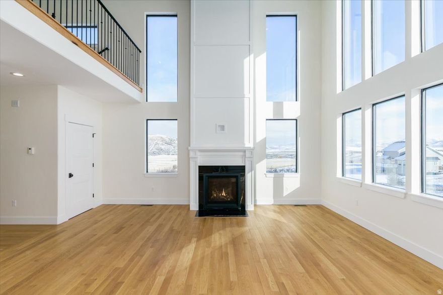 New construction in Bailey Creek with incredible mountain views! 3 bed / 2.5 bath with 9' walls and vaulted ceilings, tons of natural light, oak hardwood floors, clear alder cabinets, and quartzite countertops. Bright open-concept design with a gas fireplace, custom staircase, and metal handrails. All bedrooms are upstairs with the laundry room on the same level, including a spacious primary suite with an oversized bathroom featuring a soaker tub and large shower. Enjoy the redwood back deck, plus a 2-car heated garage. Walk-out basement is framed and insulated with electrical and plumbing in place designed for a future bedroom, bathroom, and family room. New photos, video walkthrough, and 3D tour available here: https://portneufvalleyphoto.hd.pics/1216-Discovery-Cir/idx Built and owned by the listing agent. Contact listing agent for a showing today!!