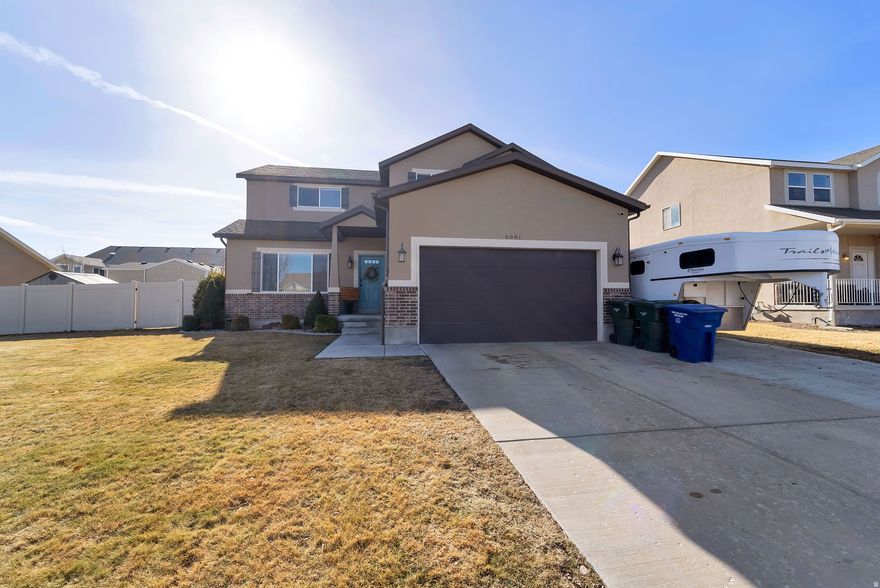 ****OPEN HOUSE******  Friday 4:30- 6pm, Saturday 11:00am -1:30pm 2-story in West Valley City with real upgrades and functional space throughout. Located minutes from Mountain View Corridor, parks, schools, and shopping for easy commuting and daily convenience.  Main floor features 9-foot ceilings, hardwood flooring, and a true open-concept layout. The kitchen connects directly to the expanded back patio, creating seamless indoor-outdoor living. Perfect for hosting, grilling, or simply enjoying the backyard.  Upstairs offers 3 spacious bedrooms, including a custom oversized primary suite created by combining a loft and bedroom. This gives you a large, flexible retreat with room for a sitting area, office, or workout space without sacrificing bedroom size.  The basement is framed and drywalled, saving you time and money. Finish it to add instant equity and additional living space.  Recent improvements include:  Brand-new water heater  Expanded patio  Fully fenced yard  Full-length RV pad  If you are looking for move-in ready with space to grow, usable upgrades, and RV parking, this home is worth seeing in person. Schedule your showing before it's gone.  Sq. ft. from county records, buyer to verify all.