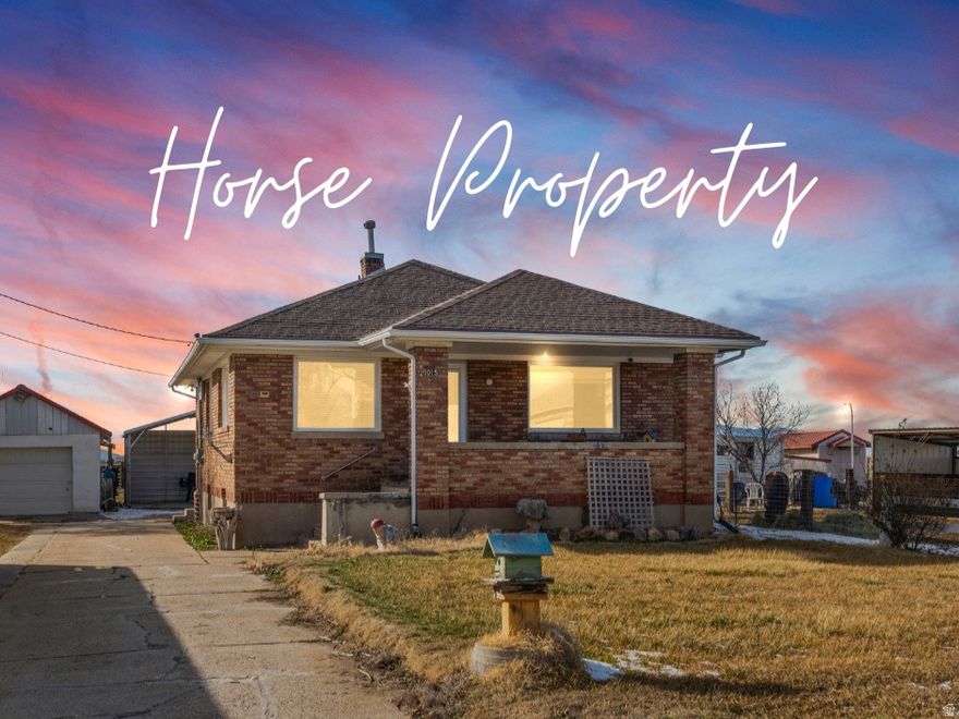 Discover an exceptional opportunity to own a charming horse property in the heart of peaceful Hooper, just moments from the rodeo grounds and tucked along a quiet rural road. This inviting setting offers the perfect blend of rural tranquility and everyday convenience. The home is filled with warmth and timeless character, offering a welcoming space that is move in ready. The upper level features a comfortable living room along with a cozy sitting area centered around a gas fireplace, creating the perfect place to unwind after a long day. Two bedrooms and one full bath complete the main level. Downstairs, you will find an unfinished bedroom and additional space ready for your personal touch, providing the opportunity to expand and create something truly your own. Outside, mature trees and established rose bushes create a picturesque and peaceful backdrop. Permanent Jellyfish Holiday lighting adds a festive touch year round with customizable seasonal colors. The property is exceptionally functional for the equestrian and animal enthusiast, featuring irrigated pasture, a 15x10 horse lean to shelter, wash rack with horseshoeing hitching post, hay storage shed, garden area, and chicken coop. A one car garage with attached shop, covered carport, and dedicated dog run provide added versatility. There is also generous space to easily accommodate parking for horse trailers, RVs, and recreational vehicles. A brand new furnace, less than one year old, offers added comfort and peace of mind. This is a rare opportunity to enjoy refined country living with an ideal animal setup in one of Hooper's most desirable rural locations. Square footage figures are provided as a courtesy estimate only. Buyer is advised to obtain an independent measurement.