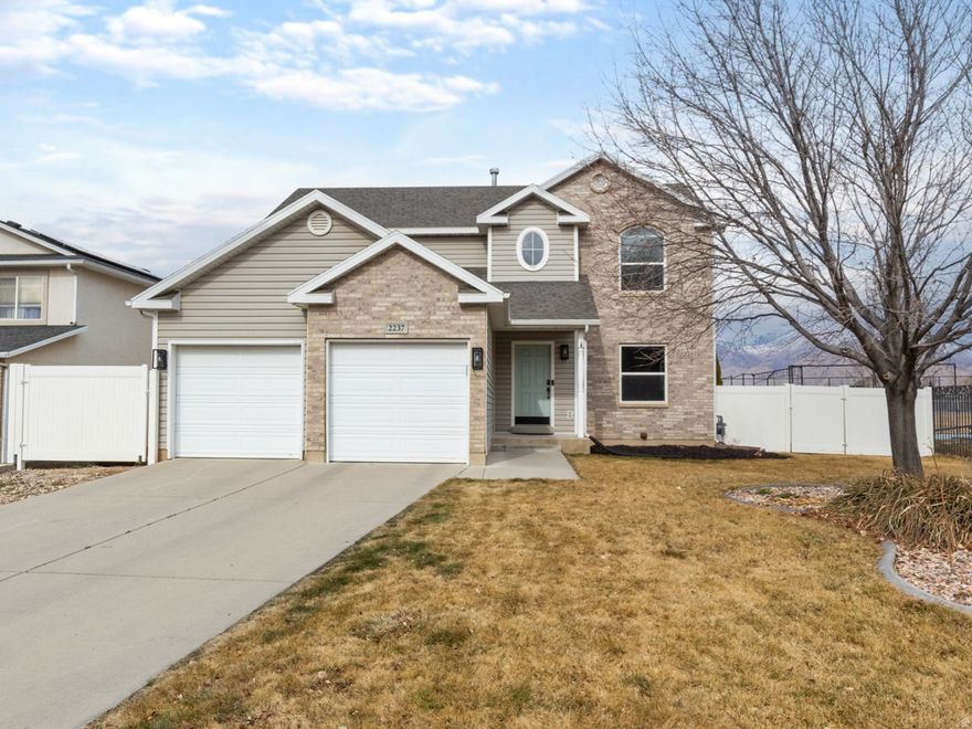 Welcome to this beautifully maintained 5-bedroom, 3.5-bath home nestled on the desirable East Bench of Spanish Fork. Perfectly positioned to capture breathtaking views of the Wasatch Mountains, this property offers the rare combination of scenic beauty and everyday convenience. Backing directly to an elementary school, the backyard feels exceptionally open and spacious with no immediate rear neighbors-creating a peaceful setting ideal for relaxing evenings, entertaining, or play. Inside, you'll find a thoughtfully designed layout with generous living spaces, a functional floor plan, and room for everyone. With five spacious bedrooms and three and a half bathrooms, there's flexibility for guests, a home office, or multi-generational living. Located in a beautiful, established neighborhood, this home is just minutes from shopping, parks, schools, and everyday amenities-giving you the best of comfort and convenience. If you've been looking for views, space, and location all in one, this East Bench gem delivers.   Square footage figures are provided as a courtesy estimate only and were obtained from Utah County Records.  Buyer is advised to obtain an independent measurement.