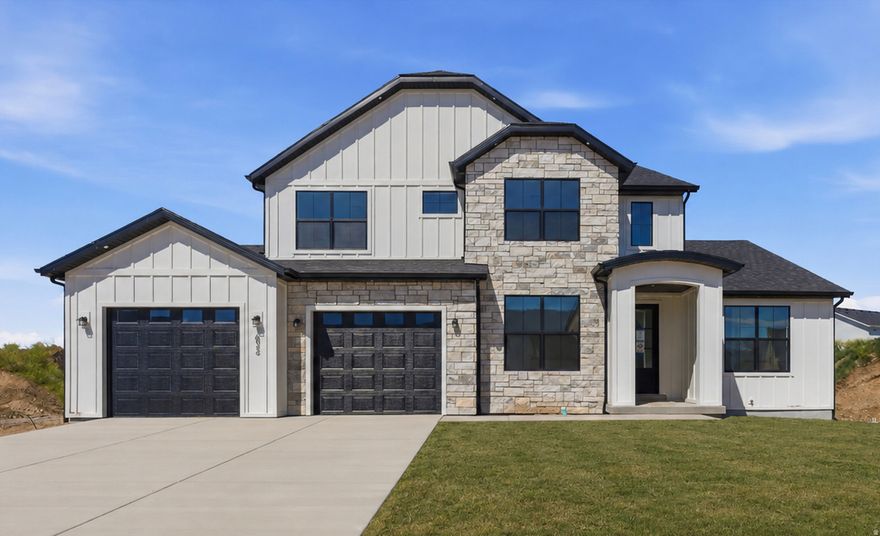 Welcome to the Blossom plan, a brand-new, move-in-ready home offering 6 spacious bedrooms, including a main-floor primary suite, and a fully equipped Accessory Dwelling Unit (ADU). Whether you're accommodating extended family or looking for rental income potential, this home is designed to adapt to all stages of life. Located in a new community with no HOA, this home is just steps from Spanish Fork Main Street, the new FitCity Center, and the scenic river trail system, putting dining, fitness, and outdoor recreation right at your doorstep. Inside, the kitchen features a 36" gas range and a full butler's pantry that keeps prep work and storage neatly out of sight. Vaulted and tray ceilings add an open, airy feel throughout, while the primary suite offers a separate soaking tub and walk-in shower. The oversized ADU is built with 10' foundation walls and includes a full kitchen, 2 bedrooms, and a dedicated laundry room. An additional suspended slab basement provides flexible space perfect for a home theatre, gym, or storage. Front yard landscaping will be added prior to close. A homebuilder warranty is included. Buyer to verify all details.