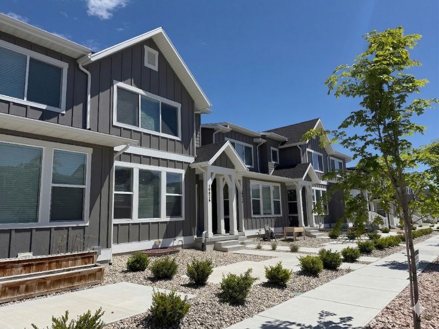 Discover this beautifully designed 3-bedroom, 2.5-bath townhome nestled in a highly desirable and growing community just minutes from American Fork Canyon. Enjoy breathtaking mountain views and easy access to outdoor recreation, including nearby Ridgeview Park with pickleball courts, playgrounds, and scenic walking trails. This move-in-ready home features an open-concept main level with durable luxury vinyl plank flooring and a stylish kitchen complete with quartz countertops and a gas range-perfect for both everyday living and entertaining. Upstairs, the spacious primary suite offers a comfortable retreat, while additional bedrooms and a loft providing flexibility for family, guests. Energy-efficient upgrades include a modern heat pump and tankless water heater for added comfort and savings.  Conveniently located near Lone Peak High School and other top-rated schools, this home combines contemporary finishes with low-maintenance living in one of the area's most sought-after neighborhoods.