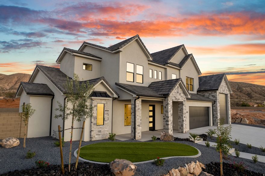 Sitting proudly at the top of the Washington Bench, this fresh modern build delivers dramatic skyline views & private, unobstructed living with no rear neighbors.This home is fully finished inside and out from the crisp, modern landscaping to a backyard perfectly prepped and positioned for your future dream pool. Car lovers, adventure seekers will fall in love with the 4-car garage featuring a massive 43' RV bay, plus an exterior pool bath with shower and a dedicated outdoor storage room because convenience shouldn't be optional. Inside the main floor delivers effortless luxury with a bright and spacious primary suite, with an oversized walk-in closet plumbed for a stackable W/D. A charming office sits just off the entry, and the walk-through butler's pantry is ready for holiday prepping. Head upstairs to find a huge bonus room, three generously sized bedrooms, a Jack & Jill bath, an additional full guest bath, and a large laundry room that keeps everything organized and easy.Set within walking distance of the school, park, hiking trails, and equestrian trails, this home sits in a beautiful new neighborhood with no HOA, runs on Dixie Power, and offers fiber internet, the perfect blend of convenience, charm, and high-performance living.