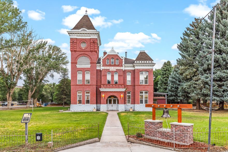 The Historic Junction Courthouse was built in 1903 as the Piute County Courthouse, and is now a wonderfully remodeled nightly rental, family gathering hub, or corporate retreat. It a holds a prominent corner in the center of Junction, and has been listed on the National Register of Historic Places. It was designed by architect Richard C. Watkins and is an excellent example of Edwardian architecture. The building's red bricks were formed on the building site. With eight tastefully remodeled bedrooms, Five bathrooms, and several large dining and entertaining areas, the courthouse has been the scene of many weddings, family reunions, business retreats and various recreational gatherings. Located on the Paiute Trail System, just 5 minutes from Piute Reservoir, 20 minutes from Otter Creek reservoir, less than an hour from Bryce Canyon or Panguitch Lake, and just a little further to Zion National Park. It is now your chance to operate this successful business, add a personal "getaway", or create an amazing corporate retreat. There is great opportunity to expand the winter month occupancy with snowmobiling, ice fishing, and National Parks nearby.