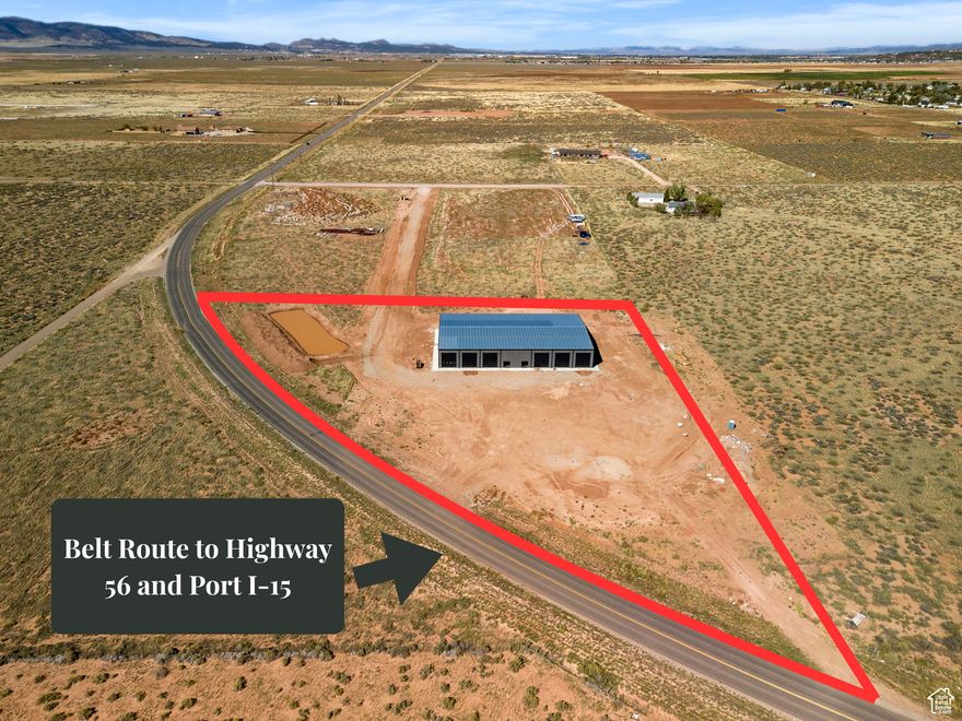 High traffic 4.96 acre commercial lot with 15,000 sq ft climate controlled building located off Hamilton Fort exit in Cedar City. Property has freeway visibility and near a Sinclair gas station. 3850 W also is considered Iron County's belt route and take you directly to Hwy 56 and Port-15 Industrial project. This is the perfect location for a business. 8 inch concrete floors reinforced with rebar and fiber. 12- 16ft tall bay doors. The building is set up like a duplex for 2- 7,500 sq ft sides under one roof making the option to lease out a side a great investment. Each side comes with just under 900 sq ft of office space, bathrooms, and storage. Each side also comes with a 2nd level mezzanine adding close to 800 sq ft of additional office/storage space. Ready in November 2025. The seller is willing to lease either side (7500 square feet) of the building.