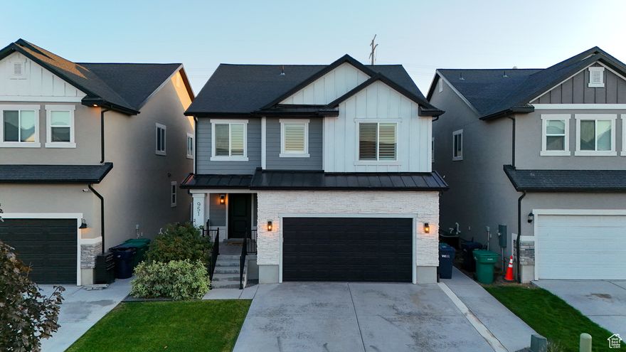 This is not your standard Bluffdale two-story. Built in 2019, this home feels brand new in all the right ways. From the flooring to the fixtures, every inch of this home has been renewed with intention by Canyon Craft. Their signature craftsmanship carries through every space.  Step through the front door into a spacious entryway that immediately sets the tone for the rest of the home. The layout flows naturally into a bright open-concept kitchen and living space that feels warm and inviting. The kitchen has been completely refreshed with modern backsplash, upgraded fixtures and designer curated paint. It features quartz countertops, a large overhang island, gas range and stainless steel appliances.   The LVP flooring continues through the main floor into the living room where a gas log fireplace with a shiplap and stone surround creates a perfect focal point. Oversized windows bring in soft natural light, complemented by maintenance free, hardwired roller shades (no recharging battery packs, yay!). The entire main floor is designed for everyday living with a sense of comfort, style and privacy.  Upstairs, the oversized primary suite feels like a retreat. The ensuite bathroom features dual sinks, a large walk-in closet, and an elegant partial euro-glass shower. Two additional bedrooms, a full bathroom, and a large laundry room complete the upper level, giving plenty of space and function. The second story feature custom shutter window coverings in all the windows.  The fully finished basement adds even more versatility. A large second living room makes a great theater or playroom. The fourth bedroom, complete with French doors, works perfectly as a home office or guest space. A third full bathroom ties the basement together and makes it ideal for long-term guests or a growing household.  Outside, the backyard is private and peaceful. Mature trees line the property, creating a natural sense of separation. The patio with fire pit adds an inviting outdoor living space that works in every season. The two-car garage is spotless, finished with epoxy flooring and space for two vehicles and extra storage.  This home blends modern luxury with thoughtful detail in a way that feels effortless. From the craftsmanship to the finishes, every inch has been cared for. It's the kind of home that feels custom the moment you walk through the door. Staging has been done by Stage 7 Design and all the furniture is available for sale.    Square footage figures are provided as a courtesy estimate only and were obtained from County Records.  Buyer is advised to obtain an independent measurement.