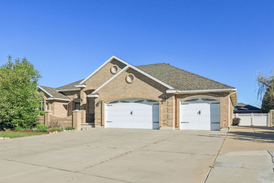 Beautiful custom brick home offering comfortable main-level living with a long list of recent upgrades. The freshly renovated kitchen features updated cabinetry, new hardware, new lighting. The main level includes fresh interior paint, new lighting and fans throughout, and new carpet in the living room, creating a bright, move in ready feel. Bathrooms have been updated with new vanities, lighting, flooring, and fixtures. A fully renovated 400 sq. ft. sunroom-with new windows, walls, flooring, and blinds-provides yearround natural light and magnificent views especially around sunset. Major improvements include a 2023 roof, energyefficient window replacements, and a newer furnace and AC. The walkout basement is partially finished with the 2nd fireplace and offers natural light, private access, and future possibilities for generational living, additional living space, or a home theater. The finished portion of the basement includes two bedrooms, a full bath, and a gym room. Outdoor living shines with a newer deck, pergola, and waterwise landscaping, including raised garden beds. Exceptional garage capacity includes a 3car attached garage and a 2car detached brick garage (or shop) with 220 power, plus RV parking or additional parking. A full list of upgrades will be provided upon request. The home is plumbed for central vacuum and a future bathtub in the primary bath. Right in the heart of Roy. This home is virtually staged.