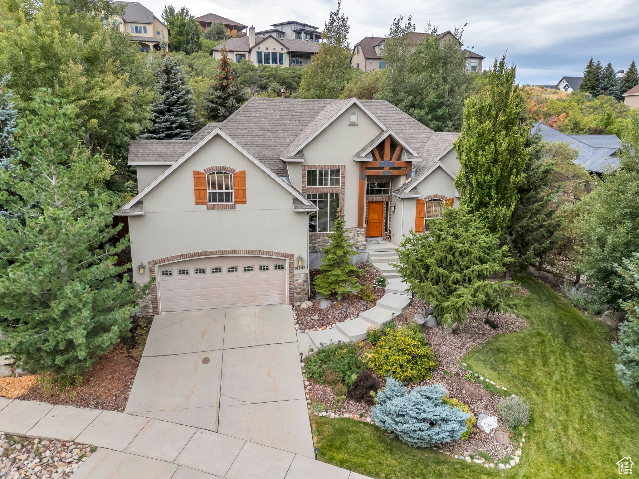 LOCATION, UTILITY, BEAUTY!! Welcome to this stunning 6-bedroom, 4-bath home in Draper's highly desirable Suncrest community-where mountain living meets modern convenience, and every day feels like a retreat. Let's start with LOCATION. Suncrest is one of the most sought-after neighborhoods along the Wasatch Front, perched high above the valley with fresh mountain air, cooler summer evenings, and unmatched views. Living here means enjoying a lifestyle full of both peace and connection-quick access down the hill gets you to I-15 and the heart of Draper. Locals love gathering at The Ridge Caf, a Suncrest favorite for artisan pizza and pasta, or heading to Voro Italian Restaurant just minutes away. For entertainment, you're close to Loveland Living Planet Aquarium, a brand new mall in the making, and an array of outdoor recreation like Corner Canyon Trails for hiking and biking, plus easy access to American Fork Canyon and world-class ski resorts. Suncrest living is truly about lifestyle, and this home puts you right at the center of it all. Now for UTILITY. This home offers 5,142 square feet of thoughtfully designed living space. The main level provides comfortable single-level living, while an expansive basement and an additional 773 square feet upstairs give you room to grow, entertain, or create specialized spaces for work, play, or guests. The great room features soaring ceilings that fill the home with natural light, while the kitchen and bathrooms are finished with stylish, high-quality touches. The home sits on a spacious corner lot with a fully fenced backyard-perfect for both privacy and play. With six bedrooms and four bathrooms, this layout is ideal for families, or anyone wanting extra space without compromising on design. And finally, the BEAUTY. From the front of the home, take in breathtaking mountain views that frame Utah's natural landscape in every season. From the back, enjoy a secluded, private setting that feels like your own personal retreat. Whether it's watching the sunrise crest over the Wasatch, taking in glowing sunsets over the Oquirrhs, or stargazing in the clear mountain air, the setting is as much a part of this home as its interior. Inside, the finishes and soaring ceilings elevate the space, while outside, the mountain backdrop and privacy make it truly exceptional. This is Suncrest living at its finest. Square footage figures are provided as a courtesy estimate only and were obtained from county records. Buyer is advised to obtain an independent measurement.