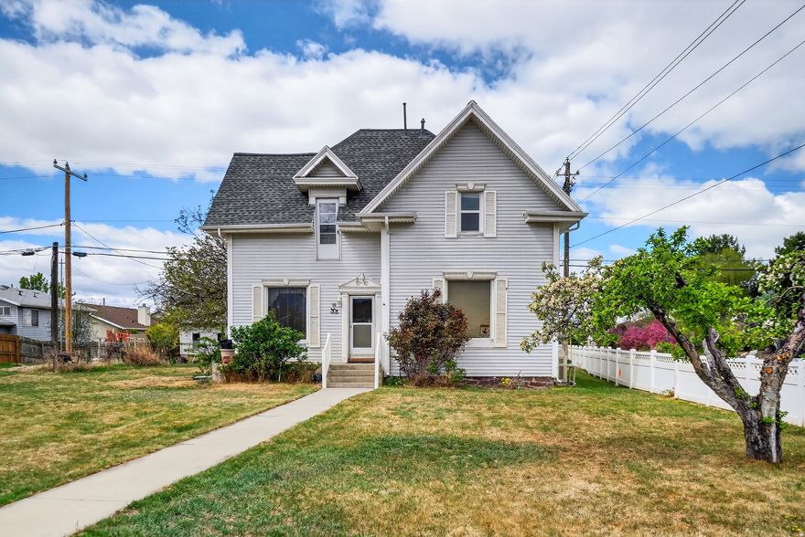 This unique property offers exceptional visibility with approximately 30,000 vehicles passing daily along Center Street. Convenient access to I-15 makes it an ideal location for both business and commuting. Built in 1900, the home features timeless character and charm rarely found in commercial-zoned properties. According to the City of Orem, the property is zoned C1, allowing for potential office use and select commercial applications. The property includes a detached garage of over 1,000 square feet, along with a separate driveway providing direct access from Center Street-an uncommon and valuable feature. The majority of the frontage faces Center Street, offering excellent exposure for signage and business presence. This location is well-suited for professional office space or similar low-impact commercial use. Additional unfinished space above the garage provides convenient storage or potential expansion. Buyer to verify all zoning, permitted uses, and development options with the City of Orem prior to submitting an offer, as commercial uses may be limited to specific types such as office space.