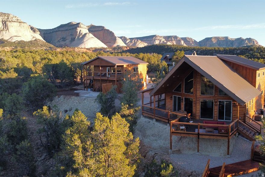 Exceptional turnkey income property in Orderville, UT - two vacation rentals with stunning views on one lot. The spacious main residence offers 3 bedrooms and 2.5 baths, while the charming guest house provides 2 bedrooms and 1 bath. Both houses have the amenities that guests are looking for when visiting the area. The main house features a tiered back deck with outdoor dining, seating, firepit and hot tub, while the casita has a private back patio with it's own outdoor dining, firepit and hot tub, both with stunning views. Each unit is marketed and operated separately, attracting consistent bookings. Immediate cash flow with a proven revenue track record. Perfect for an investor seeking passive income or an owner-operator wanting a ready-made short-term rental business. Don't miss this rare opportunity to own two high-performing vacation homes in a rapidly growing gateway to Utah's national parks Ideal location: 25 minutes to Zion National Park's East Entrance, and about 1 hour to Bryce Canyon National Park. The upcoming East Zion Visitors Center, only 20 minutes away, promises even more allure for visitors. Buyer to verify all.