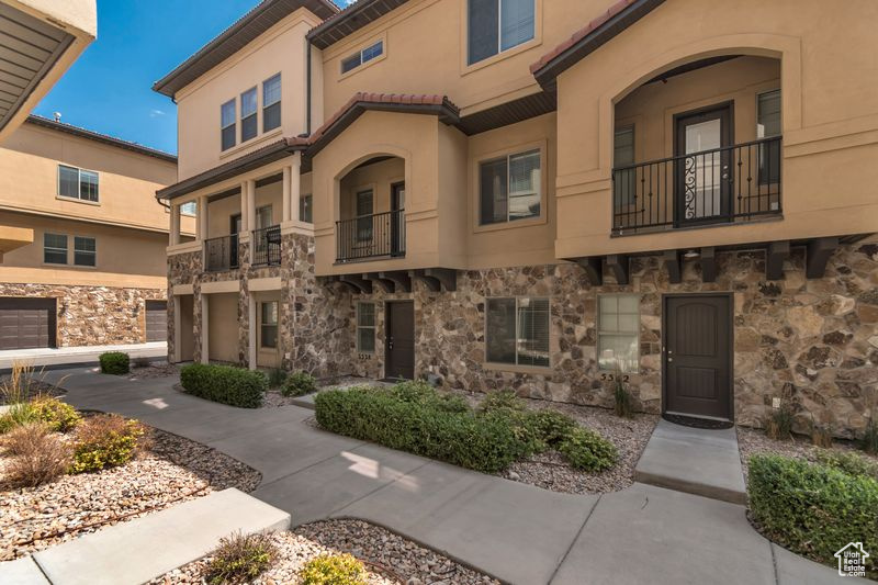 Located just five minutes from scenic American Fork Canyon, you'll have easy access to hiking, camping, and outdoor recreation. A large city park with a splash pad, walking trails, and shopping is also within walking distance. Enjoy top-tier community amenities, including a heated outdoor pool and spa, a gazebo with patio grill, a fully equipped gym, a theater room, and an entertainment space with a fireplace and full kitchen. This is maintenance free living at its finest-comfort, convenience, and outdoor adventure all in one unbeatable location. This beautifully upgraded 3-bedroom,2.5 bathroom townhome is located in one of Highland's most desirable areas. Designed with an open floor plan and flooded with natural light, the home offers a perfect blend of modern style and everyday comfort. The main level features a spacious great room complemented with wood beams and a brick wall accent, 9-foot ceilings, and recessed lighting. The kitchen boasts quartz countertops, stainless steel appliances, and abundant cabinet and pantry space. Step outside to a private balcony-ideal for grilling or unwinding. Upstairs, the luxurious primary suite is a true retreat, complete with vaulted ceilings, oversized vanity, and a generous walk-in closet. The lower level offers a versatile home office or flex space to suit your lifestyle needs.