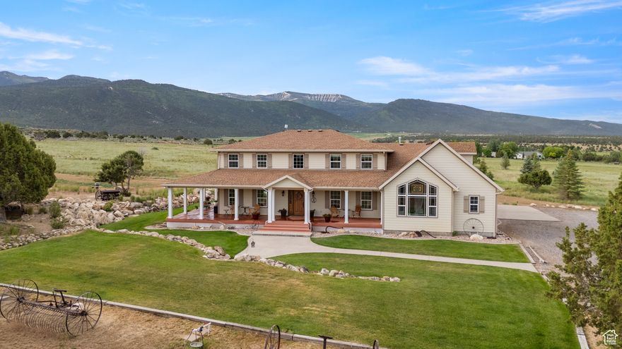 Nearly 50 acres of peaceful, low-maintenance land, just minutes from the historic charm of Spring City. Whether you're seeking a primary residence, a weekend retreat, or a remarkable venue for weddings or corporate events, this property delivers unmatched versatility. Surrounded by nature, it offers endless outdoor recreation-from ATV adventures in the nearby Manti-La Sal National Forest to cross-country skiing in your own backyard. Relax on the wrap-around deck and take in panoramic views of the majestic Horseshoe Mountain. The entire property is fenced and covered in native grasses, attracting abundant wildlife, including deer, elk, and wild turkeys. Picture yourself watching playful fawns, wintering elk, and wild turkeys roam the grounds. Inside, large windows bathe the home in natural light, showcasing breathtaking views in every direction. Two fireplaces provide warmth during the colder months, while the gourmet kitchen-complete with a Wolf range and walk-in pantry-invites entertaining and seamless indoor/outdoor living. The main floor primary suite boasts vaulted ceilings, a luxurious en-suite bathroom with a jetted tub and separate shower, a walk-in closet, and private deck access. Upstairs, four additional bedrooms, two baths, and a multi-purpose loft offer space for a home theater or game room. Other highlights include a formal dining room, an office/den, a laundry room with a built-in dog wash, and a 3-car attached garage. The basement adds over 940 sq ft of storage, including a spacious cold storage room. Outside, the estate is equipped with a 40' x 40' detached garage featuring three oversized doors, a fully powered and ventilated greenhouse, and a heated workshop ideal for woodworking or other hobbies. There's also potential for future development, with the option to subdivide the property, subject to city and county approval. Situated within Spring City's buffer zone, this estate offers an unparalleled combination of privacy and convenience, just a short drive from Provo's thriving tech scene. Known for its vibrant art community and small-town appeal, Spring City is a hidden gem. This is a rare chance to own a one-of-a-kind property that perfectly blends luxury, nature, and endless possibilities.  Shown by appointment to qualified buyers, proof of funds must be verified in advance.