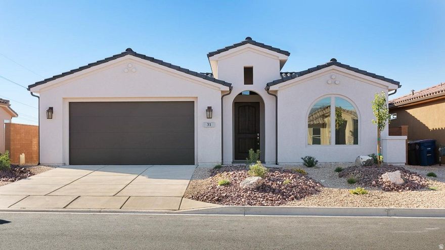 Don't miss this opportunity to own a like-new 2022 single-level home in the highly sought-after BRIO community in Washington City, Southern Utah. This upgraded ONYX floor plan features 3 bedrooms, 2.5 baths, and a 2-car garage with an open-concept layout designed for modern living. Enjoy tray ceilings, an oversized granite island, built in countertop chefs stove, soft-close cabinetry, Whirlpool appliances, and a beautifully tiled walk-in shower. Stucco exterior and tile roof offer durability and curb appeal, while desert landscaping provides easy, low-maintenance living. Outdoor lovers will appreciate close access to Red Cliffs Desert Reserve, Ice House Trail, Mill Creek Trail, Dino Cliffs Trail, Bone Wash Trail, and Elephant Arch--perfect for hiking and biking right out your door. BRIO offers, for only $120 per month, true resort-style living with multiple pools (indoor and outdoor) and spas, pickleball and tennis courts, a fully equipped fitness center, clubhouse, and beautifully maintained common areas designed for relaxation and recreation year-round. Whether you're enjoying an active lifestyle or simply unwinding in a peaceful setting, BRIO delivers an elevated living experience. This home makes an ideal primary residence, second home or vacation retreat--lock-and-leave convenience with low maintenance, incredible amenities, and close proximity to Southern Utah's outdoor recreation. Currently tenant occupied (month to month)--perfect for investors or buyers planning ahead. Opportunities at this price in BRIO are rare--act fast before it's gone!