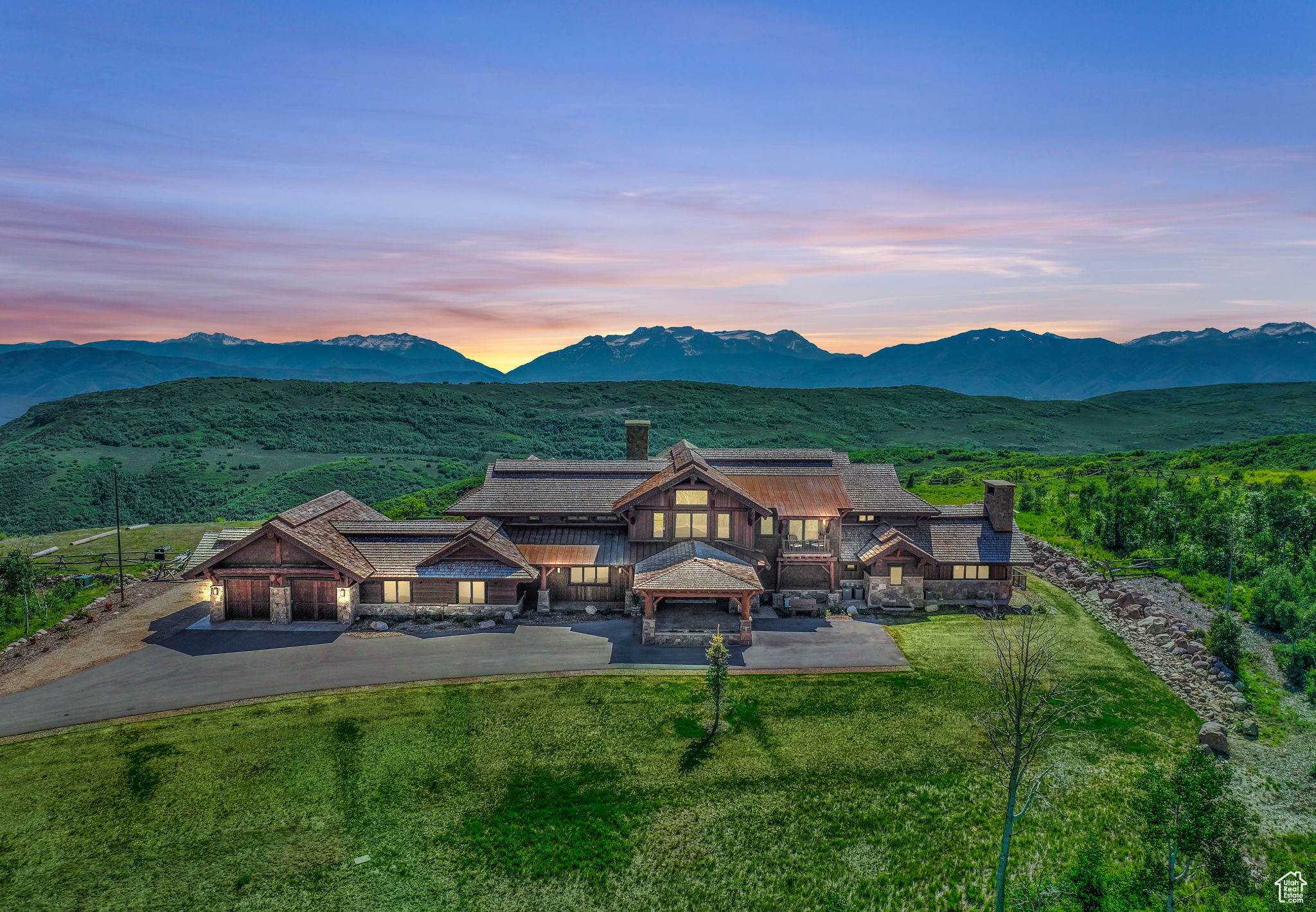 Welcome to Roll Tide Ranch  a newly-built legacy mountaintop equestrian estate set on 168 acres. Nestled within the gated Wolf Creek Ranch community, this estate offers unparalleled privacy while being just 15 minutes from downtown Heber City, 20 minutes from Heber Valley Airport, 30 minutes from Deer Valley Resort, and 40 minutes from Park City's historic Main Street. As you enter the private gate, the driveway winds through a serene mountain landscape, showcasing mature Aspen trees and hinting at the grandeur. Completed in 2020, this estate features 8 bedrooms and 11 bathrooms, providing ample space for large corporate groups, family, and friends. Guests are greeted at the heated port-a-cochere and enter through the front door, awed by a great room with 36-foot ceilings and oversized windows perfectly framing views of Mt. Timpanogos. The main level features a saloon-style bar, evoking charm and hospitality, just steps away from the home theater. Next to the office on the main level, the primary suite offers the ultimate retreat, featuring a wood-burning fireplace and vaulted beamed ceiling for a true mountain feel. The gourmet kitchen, centered around a large island topped with leathered granite, is equipped with two Wolf ranges, two Subzero refrigerators, Miele coffee station, and a butler's pantry-perfect for hosting in the dining room or on the outdoor patio with heaters and a wood-burning fireplace. The large, flat green lawn area offers complete privacy and a perfect outdoor recreational playground, for hosting weddings, and entertain family and friends. For relaxation and wellness, enjoy the yoga space with a steam room and dry sauna, or retreat to the exterior yoga deck. Additional amenities include two family rooms, climate-controlled wine room, a ventilated cigar lounge, one of two safe rooms, game room, fully equipped exercise room, laundry areas on each level, Savant home automation system, radiant heat, and air conditioning. Wolf Creek Ranch spans 13,200 acres, with 94% protected open space and year-round access via fully paved roads. Bordering 2.2 million acres of Uinta National Forest with private access, it is a haven for outdoor enthusiasts in Northern Utah. Observe elk and other wildlife from your backyard, or explore over 60 miles of community trails for hiking, biking, horseback riding, ATVing in the summer, or cross-country skiing and snowmobiling in the winter. Community amenities include the ranch center for social gatherings, a guest lodge and yurts for owners to rent, one mile of private access to the upper Provo River for fly-fishing, several ponds stocked with trout, and more-all less than an hour from the new Salt Lake City International Airport.