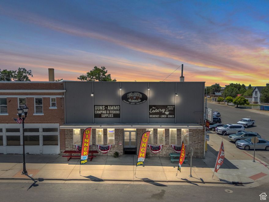 Iconic Historic Building in the Heart of Fillmore! Own a piece of history in the center of Utah's first capital city. Built in 1907 and located on the high-traffic corner of Main and Center Streets, this landmark building has been beautifully renovated and is ready to generate income. The main floor features over 7,600 square feet, currently home to a popular grocery store complete with a beer cave on one end and a lively restaurant and bar on the other. Upstairs you'll find more than 3,000 square feet of space, ideal for offices, apartments, or expansion. The 3,000-square-foot basement offers even more potential for development or storage. With high visibility, updated systems, and charm that can't be replicated, this is a rare opportunity to own a cornerstone of Historic Fillmore. Ample room remains to increase cash flow and build out unused areas to meet your vision. Inventory and equipment negotiable.