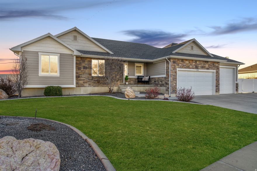 Welcome to Bridgeway Island-one of the area's most sought after communities, known for its well-maintained properties, quiet streets, and strong sense of community. Enjoy peaceful views of surrounding farmland, access to a neighborhood pool, and convenient proximity to the Legacy Freeway for an easy commute.  Step inside this beautifully updated home featuring modern finishes and durable laminate flooring throughout. The open-concept great room and kitchen create the perfect gathering space, complete with a cozy fireplace. The updated kitchen boasts quartz countertops, refreshed cabinetry, select newer appliances, stylish exposed shelving, and a spacious walk-in pantry.  The oversized primary suite offers a true retreat with a separate shower, large corner soaker tub, and walk-in closet.  Downstairs, the fully finished basement provides exceptional living space with a large second family room featuring built-in theater-style seating and plenty of room to entertain or relax. You'll also find two generously sized bedrooms with ample closet space, plus a potential sixth bedroom or expansive bonus room-ideal for a game room, home gym, or flex space to fit your needs.  Step outside to an oversized concrete patio that connects to a large RV parking area. The fully fenced backyard includes an in-ground trampoline, space for a substantial garden, and room to create the outdoor oasis you've been dreaming of.  The oversized three-car garage offers extra depth and overhead storage-perfect for vehicles, tools, and all your recreational toys.  This home truly combines space, function, and lifestyle in a fantastic community setting.