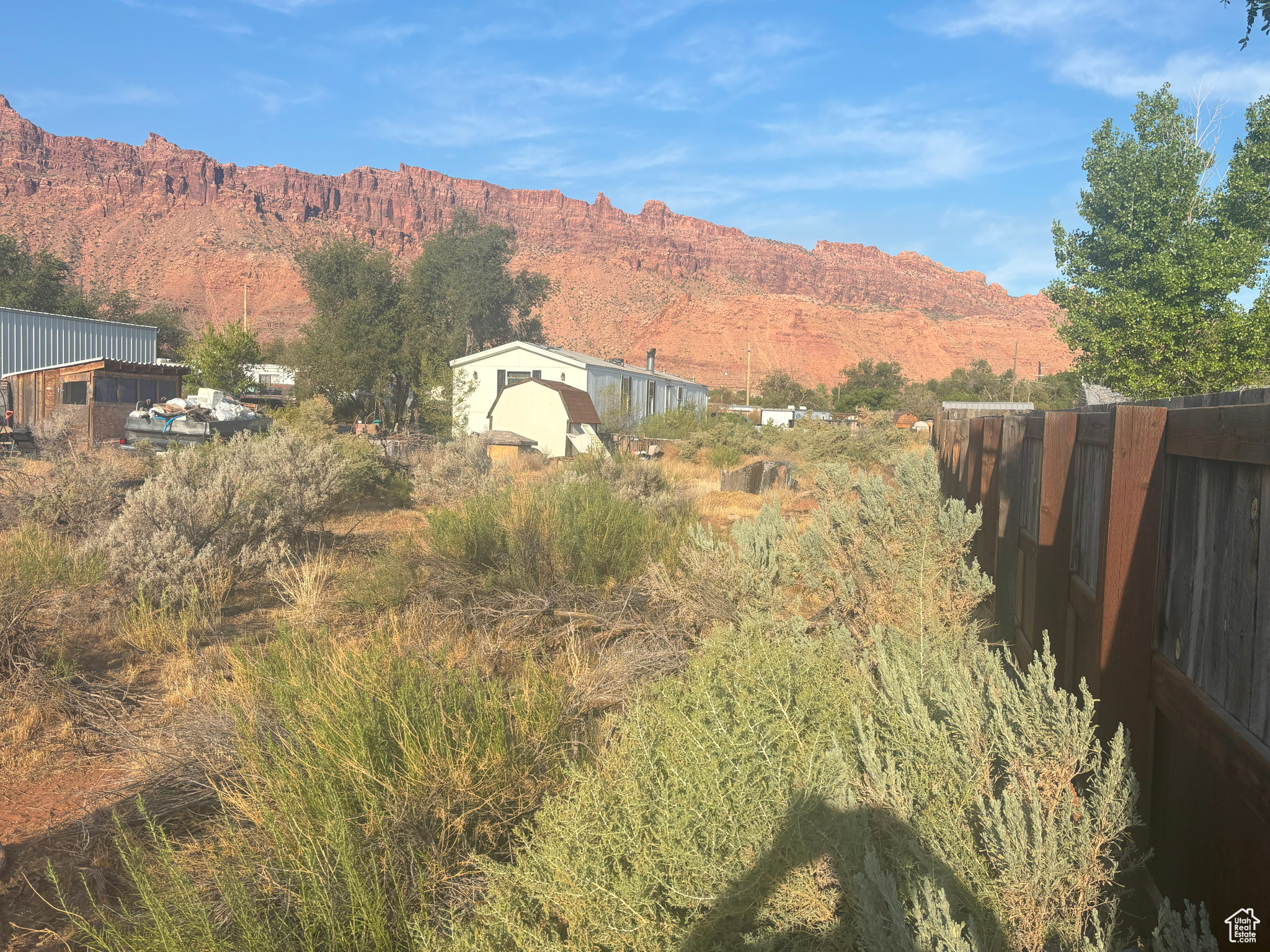 Rare find in a prime Moab location! This .99-acre lot offers stunning views, open space, and endless potential. Renovate the existing trailer or start fresh and build your custom desert retreat. Located just minutes from Old City Park, hiking trails, and downtown Moab, this property is ideal for a full-time residence, vacation home, or investment. Don't miss this opportunity to own land in one of Utah's most sought-after destinations!
