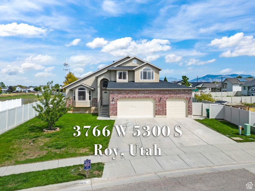 Beautiful five-bedroom home located in a quiet, family-friendly neighborhood in Roy, Utah. This spacious residence features three and a half bathrooms, a four-car garage, and an open-concept kitchen and living area ideal for modern living and entertaining. The backyard is stunning-a perfect outdoor retreat for relaxation or gatherings. The downstairs hangout area includes a stylish bar, making it great for hosting friends and family. Conveniently situated close to I-15 and near Air Force Base, this home offers both comfort and accessibility. It also benefits from secondary water, and the total square footage is provided courtesy of County Records. Don't miss the opportunity to make this beautiful house your new home!