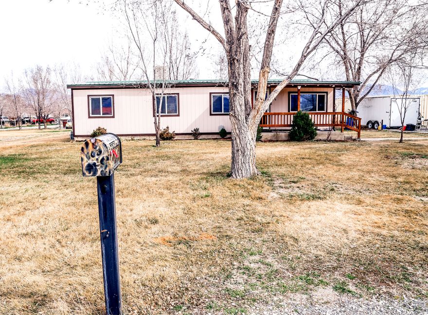 This beautiful modular/prefabricated home sits on a solid foundation and a 1 acre lot. This home is ready to move into, it has 3 bedrooms, 2 full baths, brand new double pane windows throughout, the floors have been redone with beautiful tile and freshly painted walls. The owners Recently installed a brand new 2 horse power well pump, that pumps water to your own well and septic which means no monthly water or sewer bill. The yard is fully landscaped, partially fenced with an underground dog fence in the front yard, there is a sprinkling system to water the yard, and plenty of parking including enough room for RV parking that has a 50 amp breaker to plug into. For storage there is a storage container 53' x 8.5' with electricity. The covered back deck makes a great entertaining area for family BBQ's or just to relax in the 6 person hot tub. There is a large barn to use as a workshop or for more storage. The outside of the home has been updated with new siding and a nice covered front porch to sit on to watch the beautiful sun set. This is a great house with so much potential it's ready for its next adventure with it's new owner('s). Square footage figures are provided as a courtesy estimate only. Buyer is advised to obtain an independent measurement.