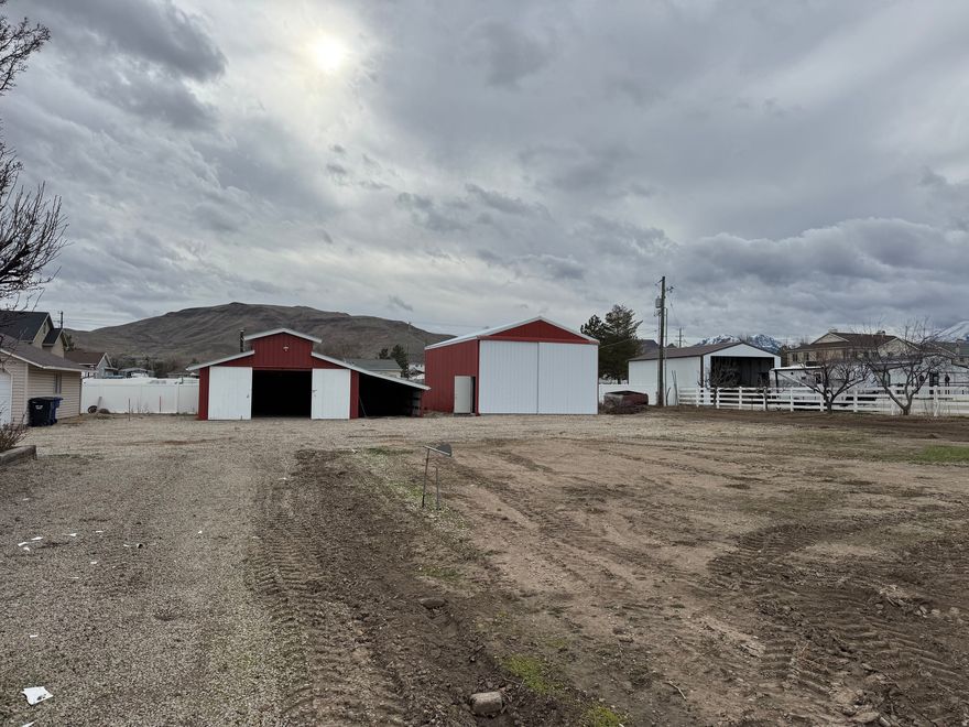 Great 1/2 acre lot. Horse property that is close to shopping and restaurants. Property includes a large detached garage and barn/workshop. Located on a quiet circle.  Buyer will need to connect utilities to property.