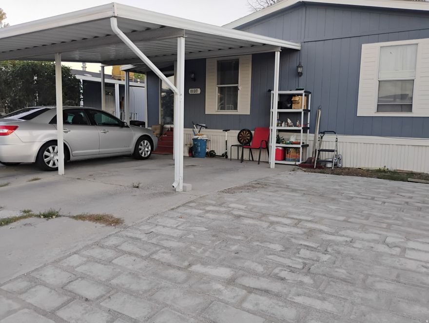 This spacious  double-wide home features a fresh new look with updated flooring and paint throughout. Enjoy many upgrades including extra parking and a private yard perfect for relaxing or entertaining. The home offers an open, layout with plenty of natural light. Conveniently located close to stores, schools, and public transportation, this property is move-in ready and waiting for its new owners to make it home!